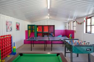 a play room with two ping pong tables at Coach House in Bude