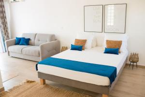 Ліжко або ліжка в номері Villa Ilo Majunga