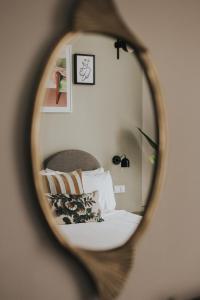 a mirror that has a picture of a cat on it at FINCH - boutique hotel, downtown in Deventer