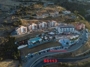 an aerial view of a resort with a road at Tus'Hotel in Castel di Tusa