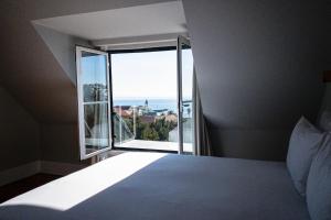 Cama ou camas em um quarto em A House in Estoril - Adults Only