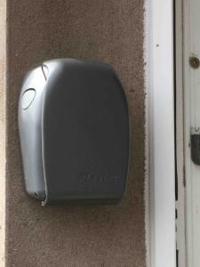 a black speaker sitting on the side of a building at Cosy 2-Bed Apartment near the beach in Morecambe in Morecambe