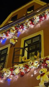 a group of teddy bears on the side of a building at Casa Kuhn in Sighişoara