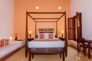 Ένα ή περισσότερα κρεβάτια σε δωμάτιο στο Hotel Quadrifolio