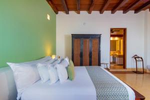 Ένα ή περισσότερα κρεβάτια σε δωμάτιο στο Hotel Quadrifolio
