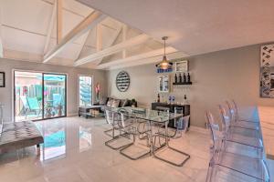 a dining room with a glass table and chairs at Coastal Resort Beach Villa - Short Walk to Shore! in Hilton Head Island