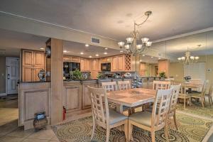 a kitchen and dining room with a table and chairs at Beachfront Indian Shores Condo - Pool and Hot Tub! in Clearwater Beach