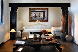 a living room with a white couch and a table at Faro Capo Spartivento in Chia