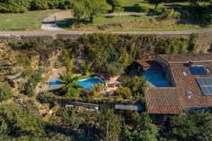 an aerial view of a house with a swimming pool at Le Soulier En Cévennes 4 étoiles in Saint-Martin-de-Valgalgues