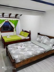 Krevet ili kreveti u jedinici u okviru objekta Hostal Villa Rosita