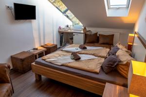 a bedroom with a large bed and a desk at Seaside-Townhouse in Timmendorfer Strand