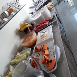 a buffet line with many different types of food at Hotel Porto Madero in Florianópolis +17 photos