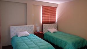 Postel nebo postele na pokoji v ubytování Hotel California Calca