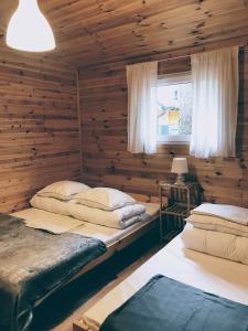 Postel nebo postele na pokoji v ubytování Domki Letniskowe MAJA