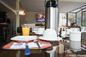 TV a/nebo společenská místnost v ubytování Hotel California Calca