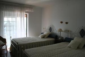 En eller flere senge i et værelse på Casa da Bela Vista