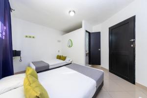 Postel nebo postele na pokoji v ubytování Ayenda 1231 Paradise Center
