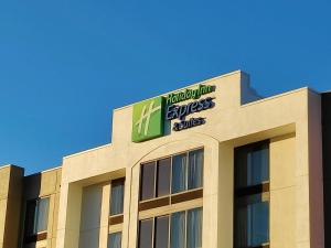 a building with a sign on the top of it at Holiday Inn Express Hotel & Suites Dallas Fort Worth Airport South, an IHG Hotel in Irving