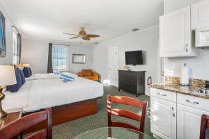 a hotel room with a bed and a kitchen at An Island Oasis in Key West