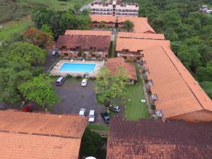 an aerial view of a house with a swimming pool at Casa De Praia Maranduba in Ubatuba