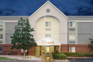 a front view of a hotel with a church at Sonesta Simply Suites Birmingham Hoover in Birmingham