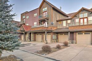 a large wooden house with two garage at Condo with Mtn Views Less Than 1 Mi to Pagosa Hot Springs! in Pagosa Springs