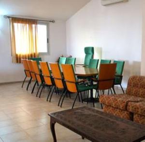 a dining room with a table and chairs at Villa Rosa in Dakar