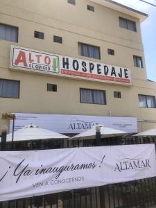 a building with a sign in front of it at Alto El Quisco in El Quisco