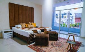 Säng eller sängar i ett rum på Casa Umiña Boutique Hotel Manta