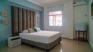 Postel nebo postele na pokoji v ubytování Hotel Boutique Casa Umiña