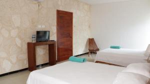 Voodi või voodid majutusasutuse Hotel Itza Coba toas