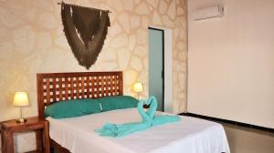 Voodi või voodid majutusasutuse Hotel Itza Coba toas