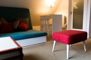 A bed or beds in a room at Brown House