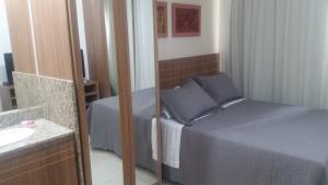 Un pat sau paturi într-o cameră la Saint Moritz - flat particular a 05 min da Esplanada