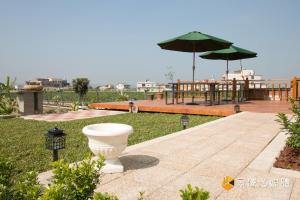 Vrt pred nastanitvijo Tong Xin Farmstay