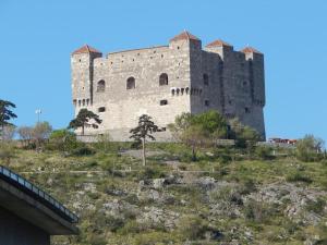 a large castle on top of a hill at Holiday home Senj 1 in Senj