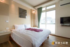Postelja oz. postelje v sobi nastanitve Tong Xin Farmstay