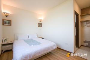 Postelja oz. postelje v sobi nastanitve Tong Xin Farmstay