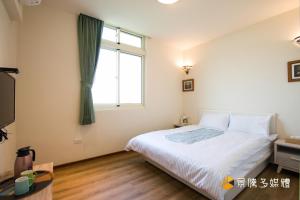 Postelja oz. postelje v sobi nastanitve Tong Xin Farmstay