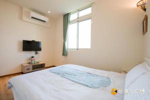 Postelja oz. postelje v sobi nastanitve Tong Xin Farmstay