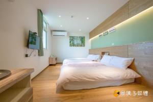 Postelja oz. postelje v sobi nastanitve Tong Xin Farmstay