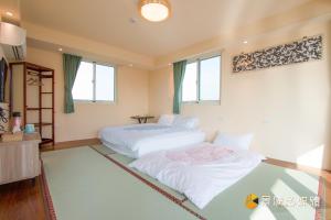 Postelja oz. postelje v sobi nastanitve Tong Xin Farmstay