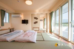 Postelja oz. postelje v sobi nastanitve Tong Xin Farmstay