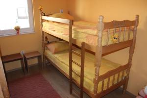 two bunk beds in a room with a window at Majdas in Mostar