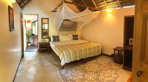 Cinnamon في أغوندا: غرفة نوم بسرير في غرفة