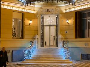 a staircase in a building with christmas lights at Lolli Palace Hotel in Sanremo