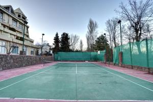 a tennis court with a tennis racket on it at Pearl Continental Hotel, Bhurban in Bhurban