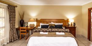 Postel nebo postele na pokoji v ubytování Antiqua Cottage