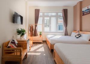 Postelja oz. postelje v sobi nastanitve Moc Thach Hostel Dalat