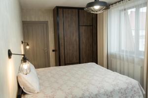 Postel nebo postele na pokoji v ubytování Elite Loft Apart